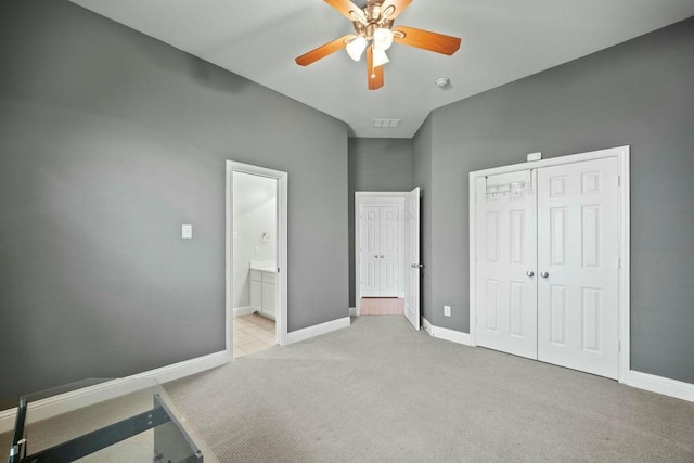 2425 Sir Lovel Ln, Lewisville, TX 75056 - unfurnished bedroom with carpet floors, a closet, baseboards, and ceiling fan