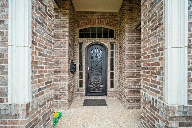 2425 Sir Lovel Ln, Lewisville, TX 75056 - view of exterior entry with brick siding