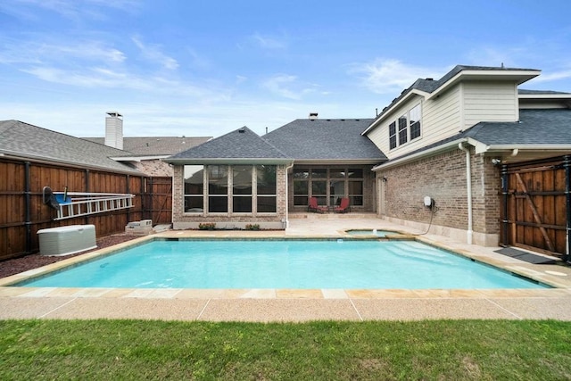 2425 Sir Lovel Ln, Lewisville, TX 75056 - view of pool featuring an in-ground hot tub, a sunroom, a fenced backyard, and a patio