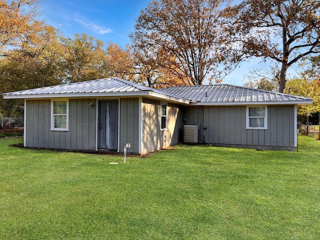 6021 Fm 3054, Malakoff, TX 75148 - rear view of house featuring board and batten siding, central air condition unit, and metal roof