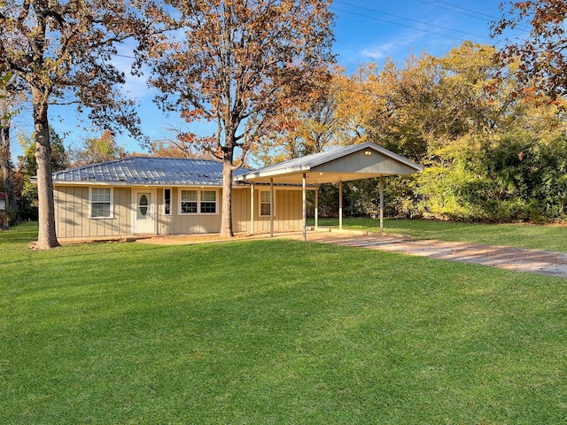 6021 Fm 3054, Malakoff, TX 75148 - rear view of house with a yard, a carport, and metal roof