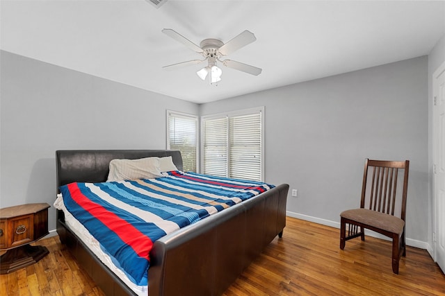 1025 N 32nd St, Waco, TX 76707 - bedroom featuring wood finished floors, baseboards, and ceiling fan