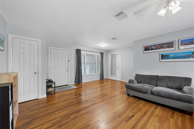 1025 N 32nd St, Waco, TX 76707 - living room featuring wood finished floors, ceiling fan, and baseboards