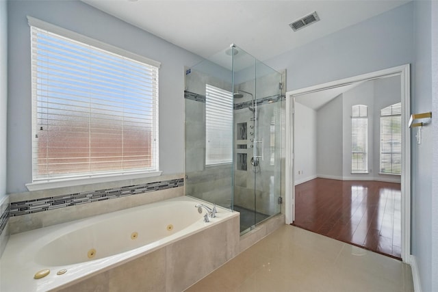 518 Hawthorne Dr, Murphy, TX 75094 - bathroom with a shower stall, a jetted tub, healthy amount of natural light, and tile patterned flooring