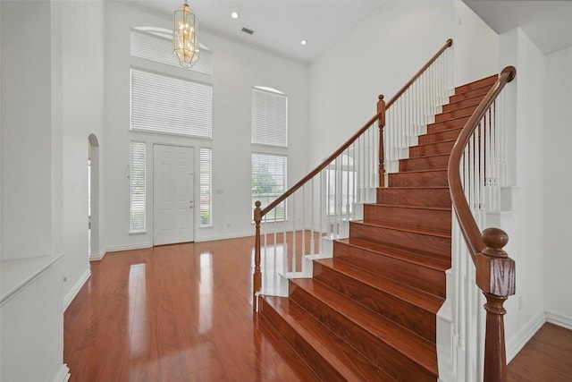 518 Hawthorne Dr, Murphy, TX 75094 - foyer featuring wood finished floors, stairs, baseboards, a high ceiling, and recessed lighting