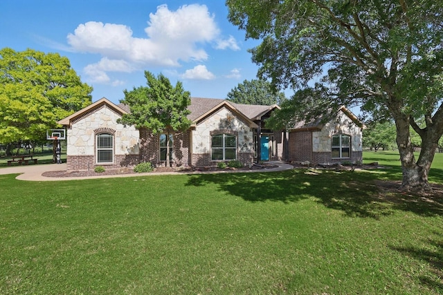 5861 Hayes Rd, Midlothian, TX 76065 - view of front of property with stone siding, a front yard, and brick siding
