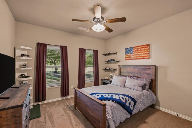 5861 Hayes Rd, Midlothian, TX 76065 - bedroom with light colored carpet, baseboards, and a ceiling fan