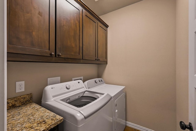 5861 Hayes Rd, Midlothian, TX 76065 - laundry room with cabinet space, washing machine and dryer, and baseboards