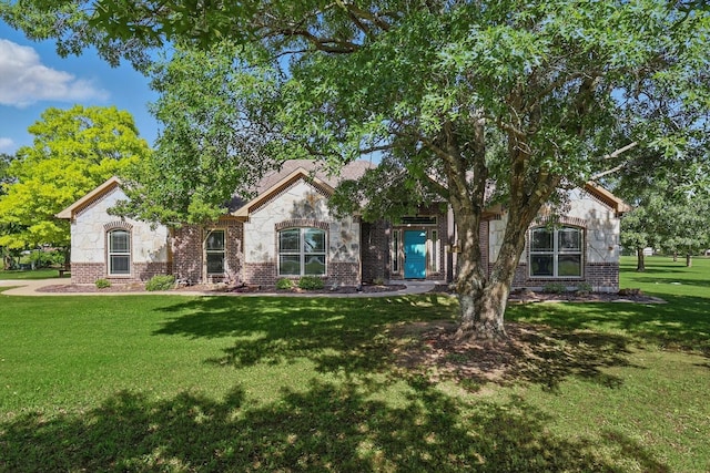 5861 Hayes Rd, Midlothian, TX 76065 - view of front of property with a front yard, brick siding, and stone siding