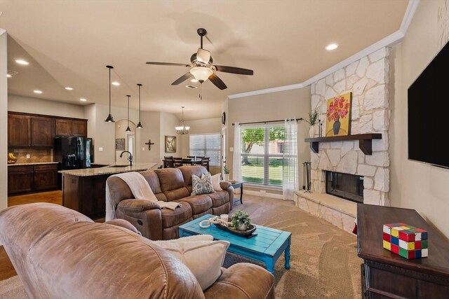 5861 Hayes Rd, Midlothian, TX 76065 - living room with ceiling fan, a stone fireplace, light carpet, crown molding, and recessed lighting