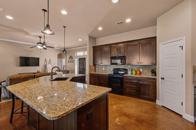5861 Hayes Rd, Midlothian, TX 76065 - kitchen featuring black appliances, a sink, finished concrete flooring, tasteful backsplash, and arched walkways