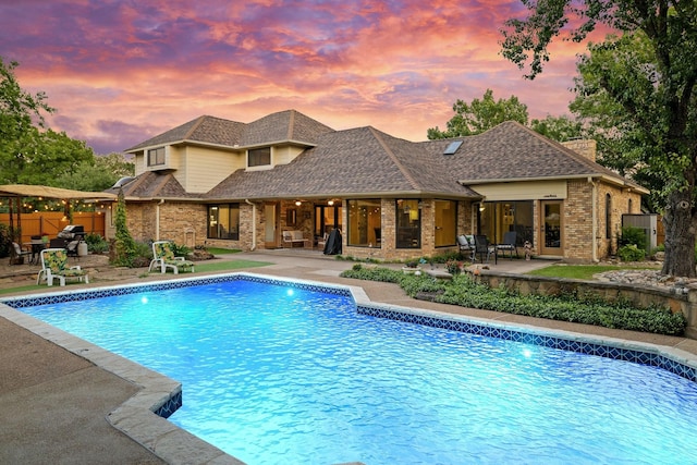 201 Split Rock Ter, Ovilla, TX 75154 - pool at dusk with a patio area