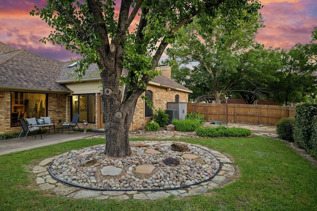 201 Split Rock Ter, Ovilla, TX 75154 - view of yard featuring a patio area, an outdoor hangout area, and central AC unit
