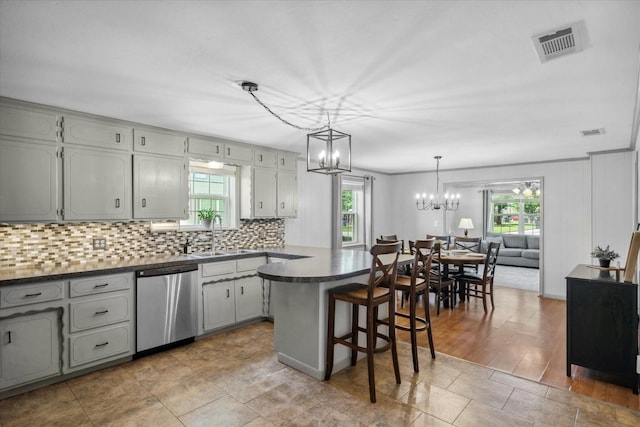 809 S Prairieville St, Athens, TX 75751 - kitchen featuring dishwasher, a sink, dark countertops, a chandelier, and plenty of natural light