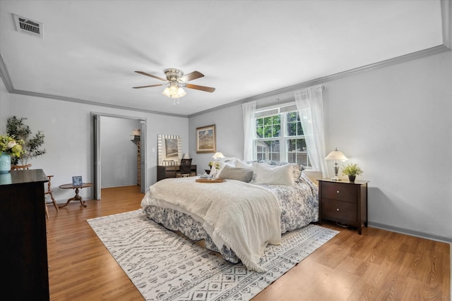 809 S Prairieville St, Athens, TX 75751 - bedroom with ornamental molding, light wood-style floors, and ceiling fan