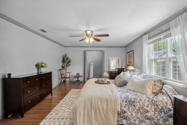 809 S Prairieville St, Athens, TX 75751 - bedroom with crown molding, wood finished floors, and a ceiling fan
