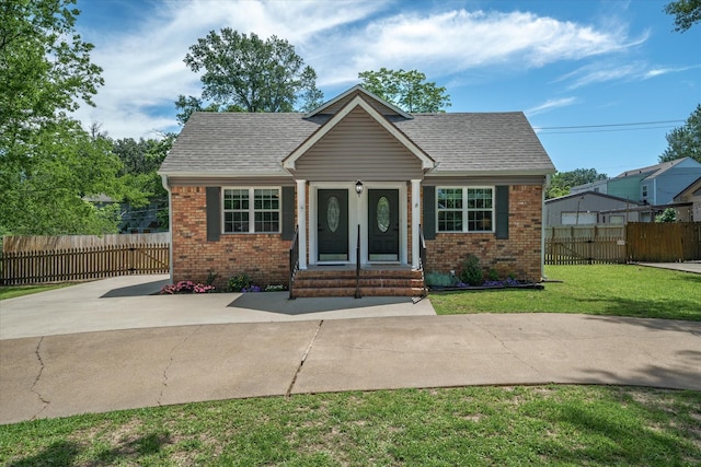 809 S Prairieville St, Athens, TX 75751 - bungalow-style home with entry steps, brick siding, and roof with shingles