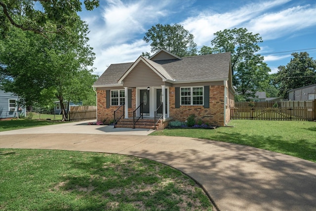 809 S Prairieville St, Athens, TX 75751 - view of front of property with brick siding, driveway, and a shingled roof
