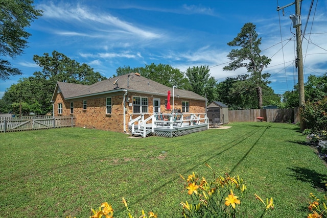 809 S Prairieville St, Athens, TX 75751 - rear view of house with a wooden deck, brick siding, and roof with shingles