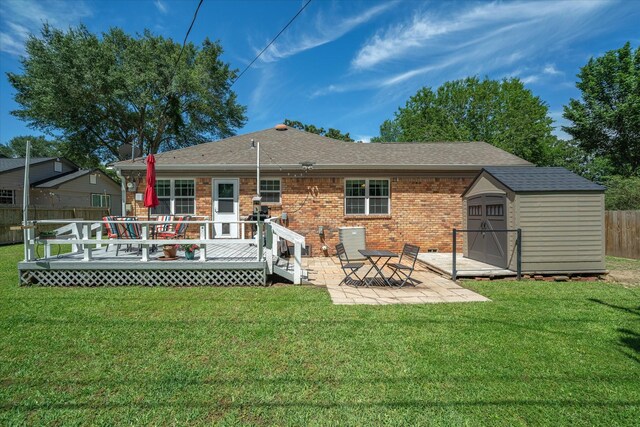 809 S Prairieville St, Athens, TX 75751 - rear view of property featuring brick siding, a patio area, a wooden deck, and roof with shingles