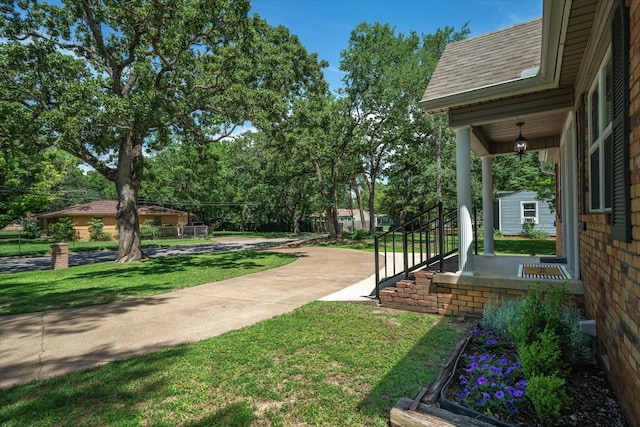809 S Prairieville St, Athens, TX 75751 - view of grassy yard with covered porch
