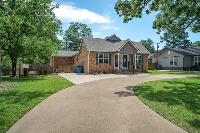 809 S Prairieville St, Athens, TX 75751 - view of front of home featuring brick siding, a shingled roof, curved driveway, and covered porch