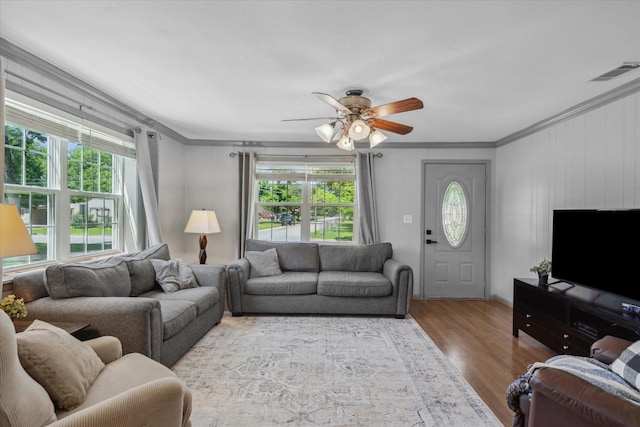 809 S Prairieville St, Athens, TX 75751 - living room with plenty of natural light, ornamental molding, wood finished floors, and a ceiling fan