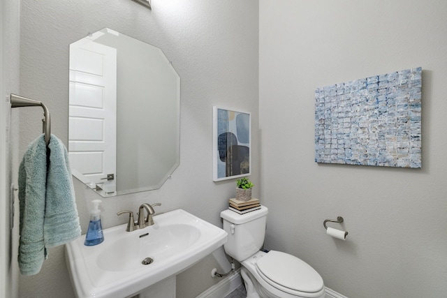 1005 Wimberly Ln, Northlake, TX 76226 - bathroom featuring a sink, toilet, and baseboards