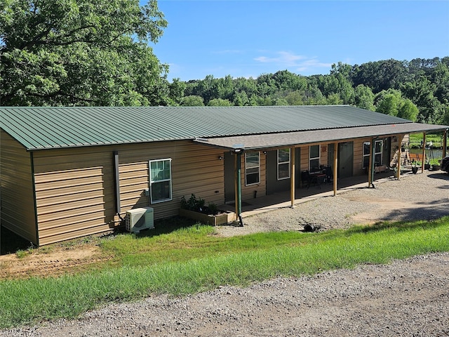 13597 County Road 35, Tyler, TX 75706 - rear view of house with metal roof and a cooling unit