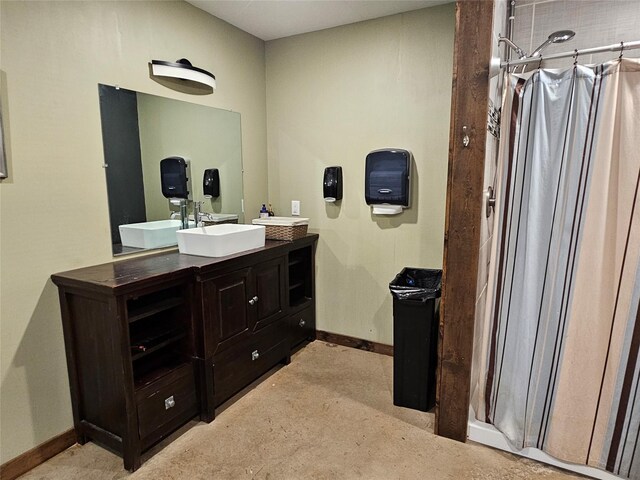 13597 County Road 35, Tyler, TX 75706 - full bath featuring vanity, baseboards, and a shower with shower curtain