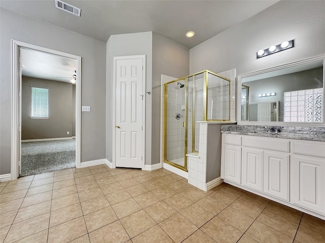5973 Country View Ln, Frisco, TX 75036 - full bathroom with a stall shower, vanity, tile patterned floors, and baseboards
