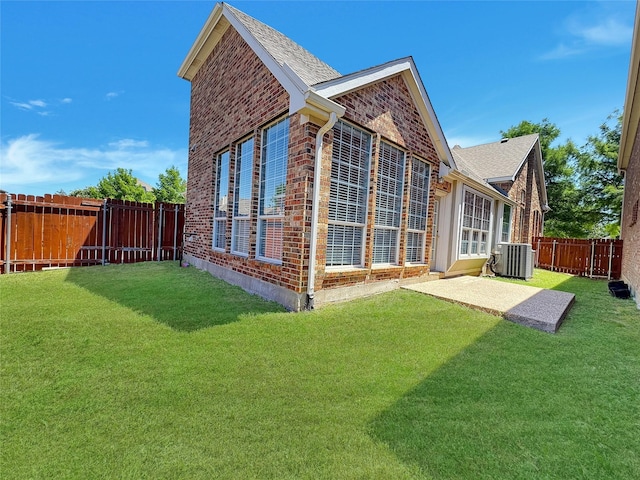 5973 Country View Ln, Frisco, TX 75036 - rear view of house with brick siding, central air condition unit, and a patio