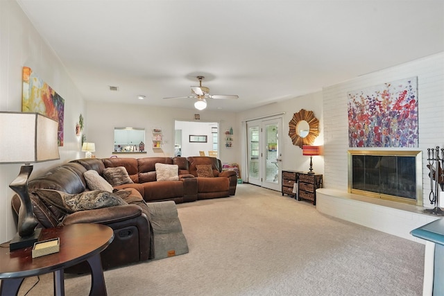 3720 Wharton Dr, Fort Worth, TX 76133 - living area with carpet flooring, a ceiling fan, and a glass covered fireplace