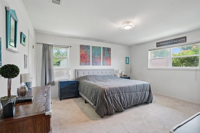 3720 Wharton Dr, Fort Worth, TX 76133 - bedroom featuring light colored carpet, multiple windows, and baseboards