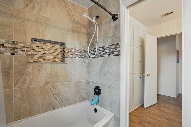 3720 Wharton Dr, Fort Worth, TX 76133 - bathroom featuring bathtub / shower combination and wood finished floors