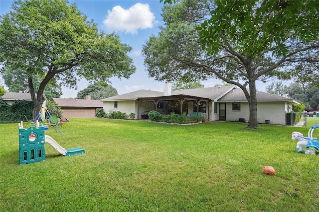 3720 Wharton Dr, Fort Worth, TX 76133 - back of house with a yard, a playground, and roof with shingles