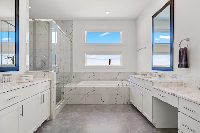 201 Carroll St, Fort Worth, TX 76107 - full bath featuring a bath, a marble finish shower, two vanities, and recessed lighting