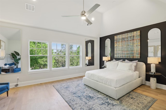 1460 N Ave, Plano, TX 75074 - bedroom featuring wood finished floors, baseboards, high vaulted ceiling, ceiling fan, and arched walkways