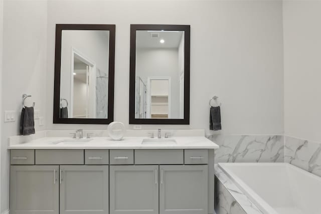 1460 N Ave, Plano, TX 75074 - bathroom featuring double vanity and a garden tub
