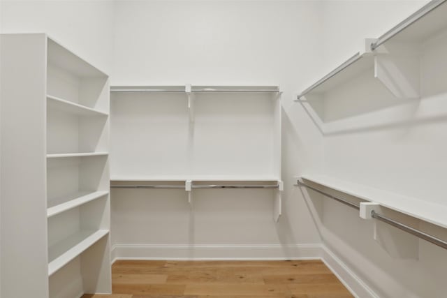 1460 N Ave, Plano, TX 75074 - walk in closet with light wood-style flooring
