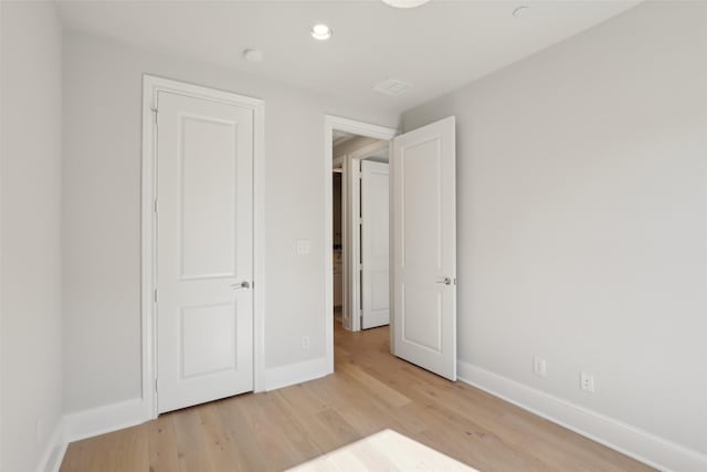 1460 N Ave, Plano, TX 75074 - unfurnished bedroom with light wood-style floors, baseboards, and recessed lighting