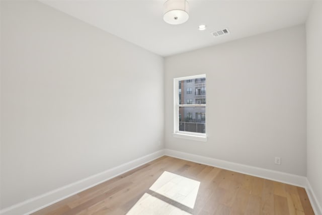 1460 N Ave, Plano, TX 75074 - unfurnished room featuring baseboards and light wood-style flooring