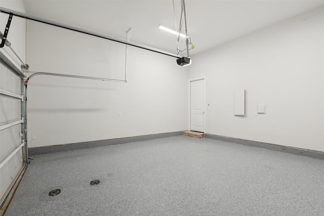 1460 N Ave, Plano, TX 75074 - garage featuring a garage door opener and baseboards