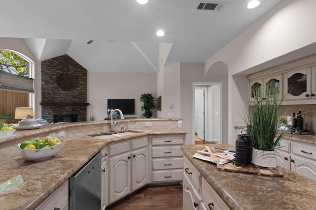 1817 Foxborough Trl, Flower Mound, TX 75028 - kitchen with stainless steel dishwasher, lofted ceiling, a sink, dark wood finished floors, and open floor plan