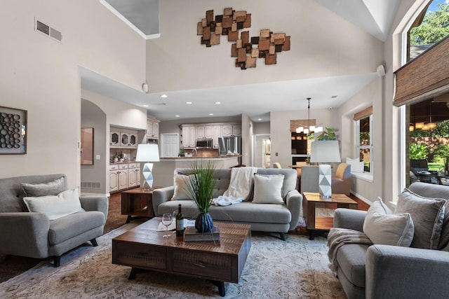 1817 Foxborough Trl, Flower Mound, TX 75028 - living area with a chandelier, a high ceiling, healthy amount of natural light, recessed lighting, and baseboards