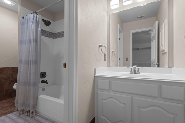 1817 Foxborough Trl, Flower Mound, TX 75028 - bathroom featuring shower / bath combo with shower curtain, vanity, a textured wall, tile patterned flooring, and toilet