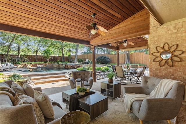 1817 Foxborough Trl, Flower Mound, TX 75028 - fenced backyard featuring outdoor dining space, an outdoor hangout area, a patio area, and a ceiling fan