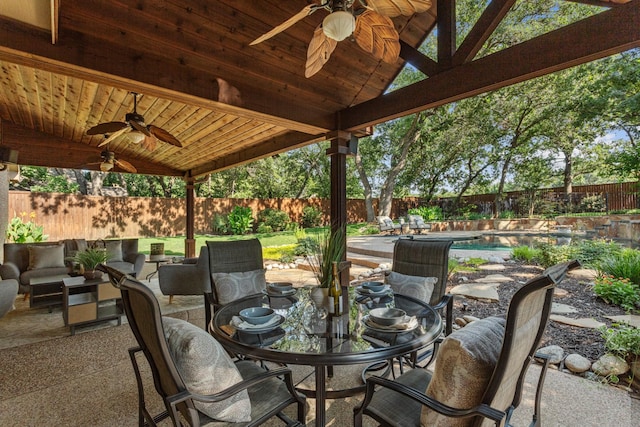 1817 Foxborough Trl, Flower Mound, TX 75028 - fenced backyard with ceiling fan, a patio, and outdoor dining area