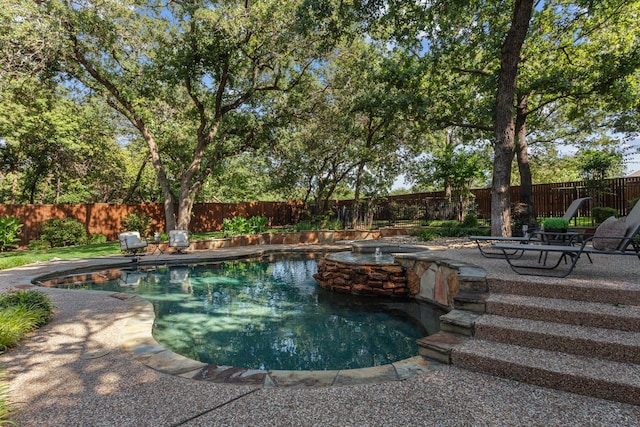 1817 Foxborough Trl, Flower Mound, TX 75028 - view of pool with a fenced backyard, a patio, and a pool with connected hot tub