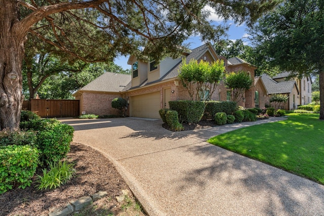 1817 Foxborough Trl, Flower Mound, TX 75028 - traditional-style home with concrete driveway, brick siding, an attached garage, and roof with shingles
